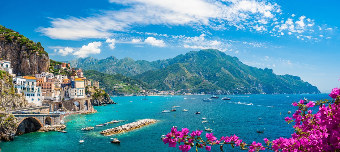 Amalfi coast italy with boats and flowers